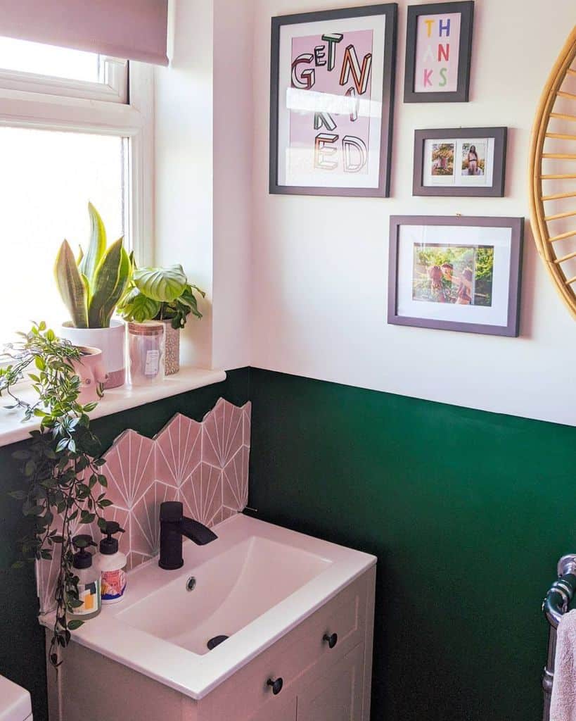 two tone green and white bathroom with small vanity 