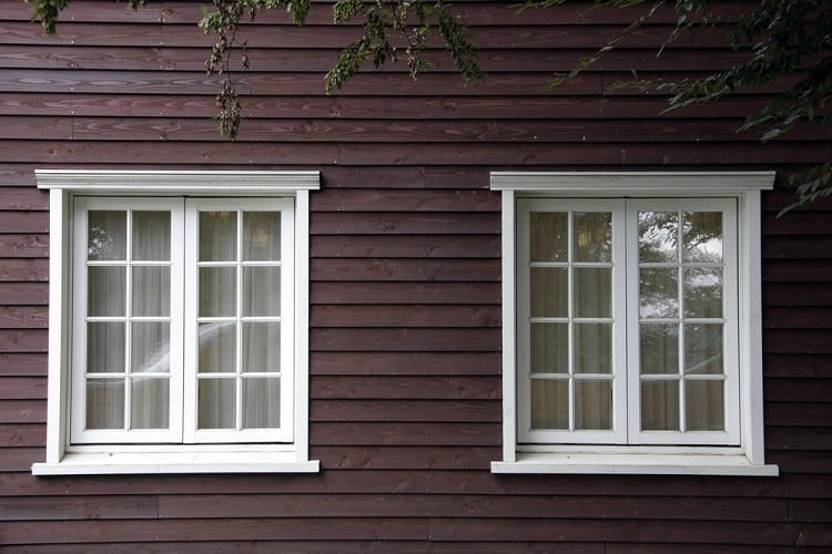 two white exterior window trim crown molding
