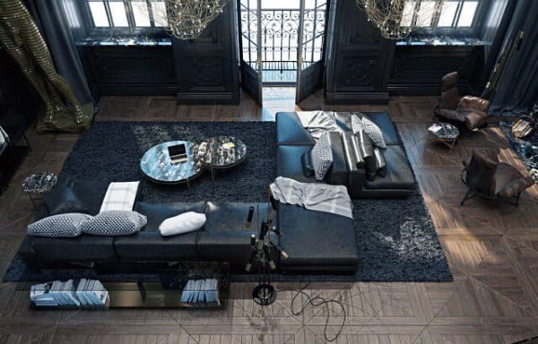 Large contemporary living room with black sectional sofa, modern decor, and dark accents.