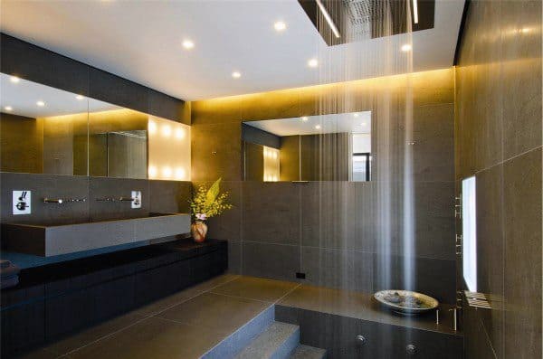 Luxury bathroom with LED strip lighting, rain shower, and floating vanity.