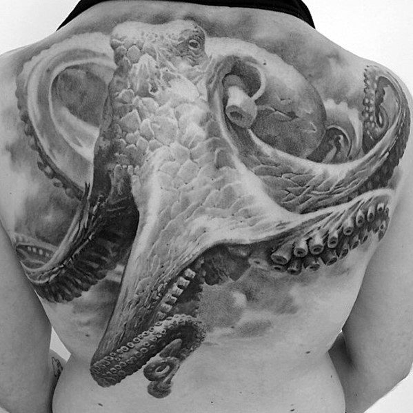 Realistic black-and-white octopus tattoo covering a person's entire back