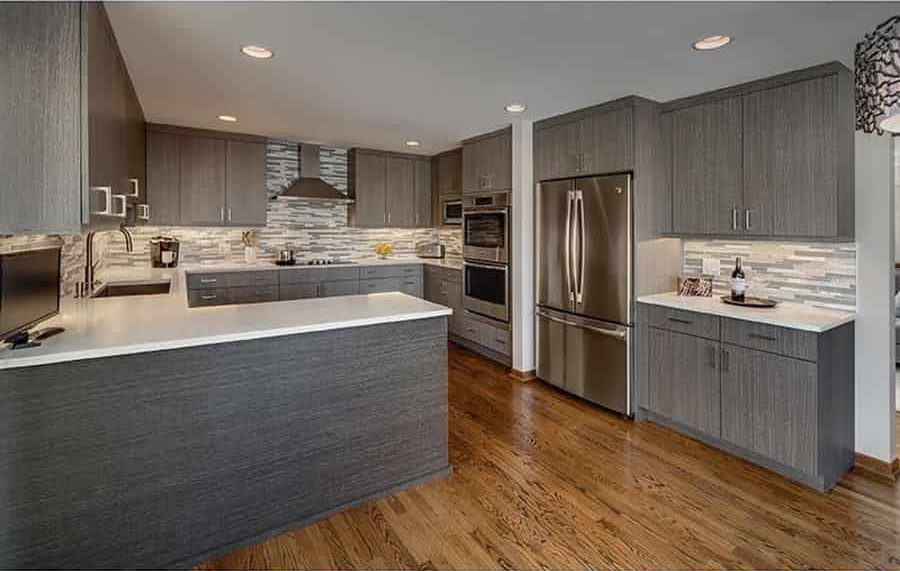 large modern kitchen with under cabinet lighting and flush mount ceiling lighting
