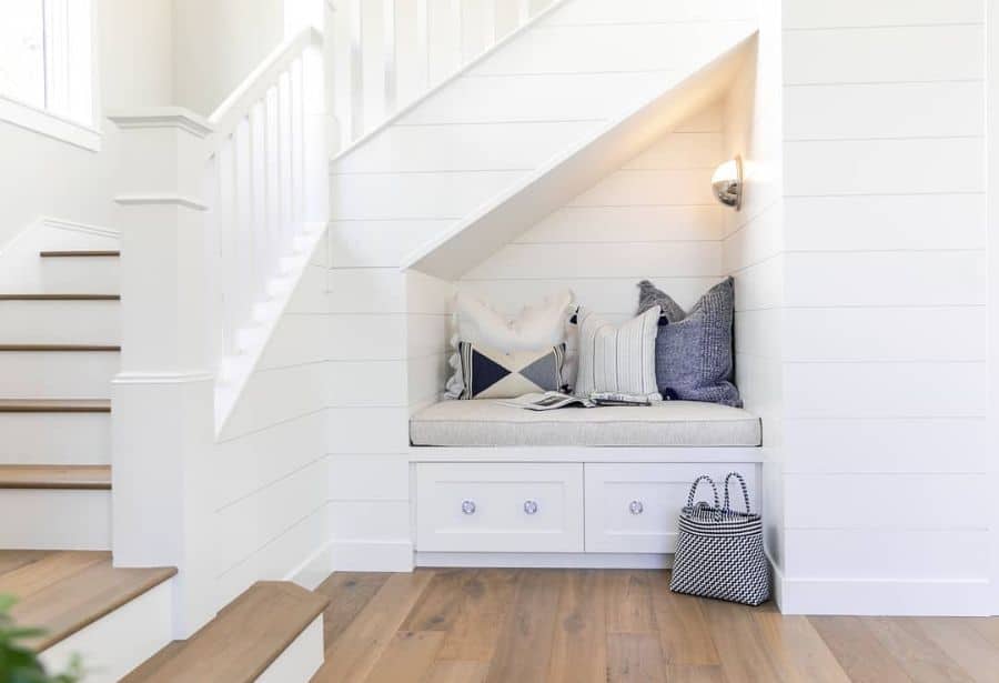 inviting under the stairs reading nook 