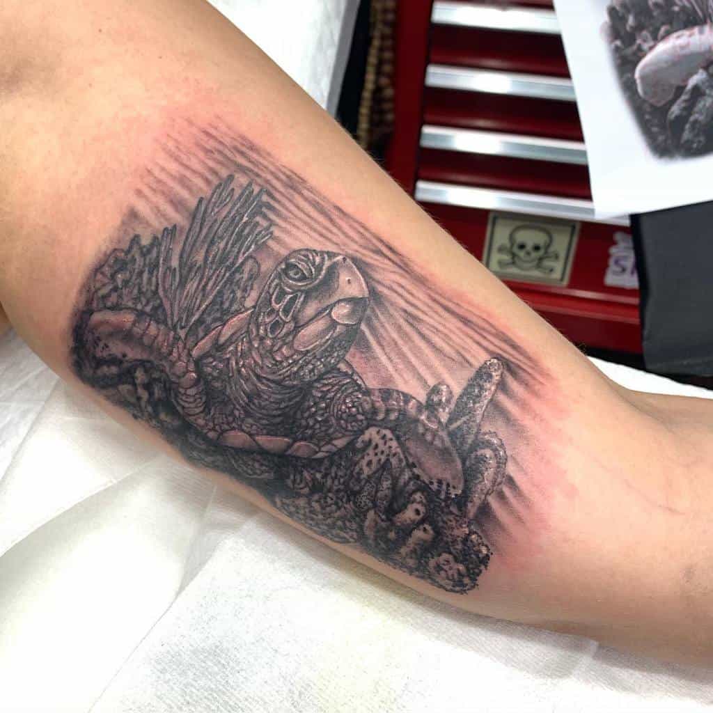 Realistic sea turtle tattoo, featuring intricate shading and underwater details for a lifelike ocean design