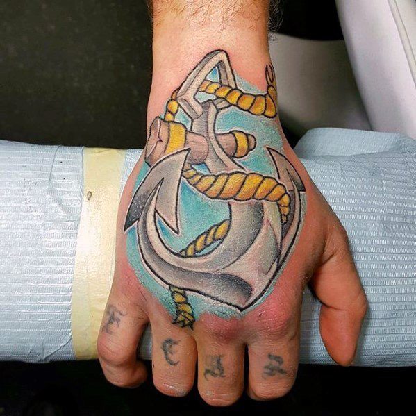 Colorful anchor tattoo with a yellow rope on the back of a hand