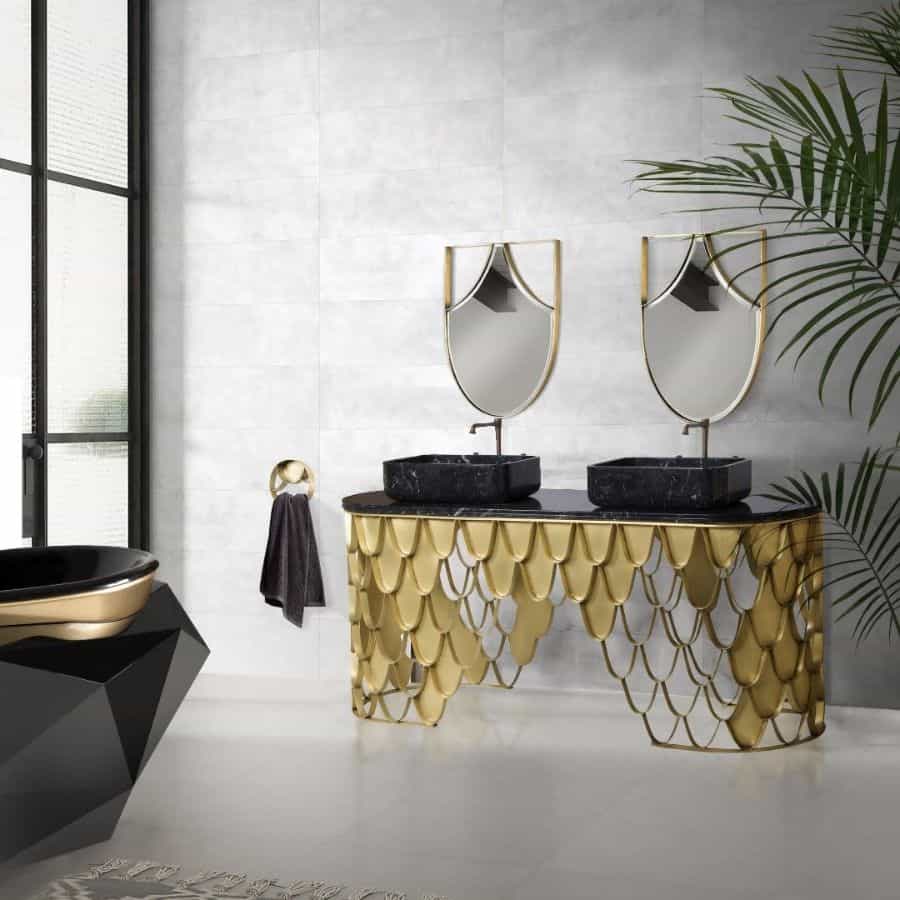 Luxury bathroom with black and gold double basin vanity, geometric bathtub, and statement mirrors.