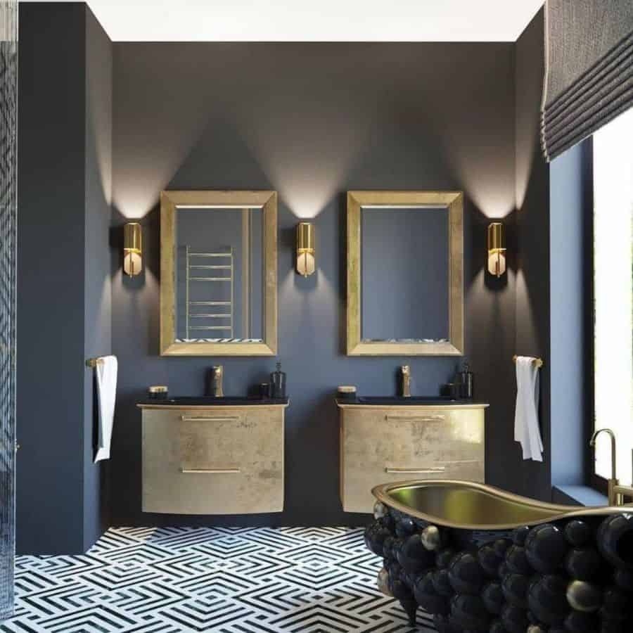 Luxurious bathroom with double gold vanities, geometric flooring, and artistic black bathtub.