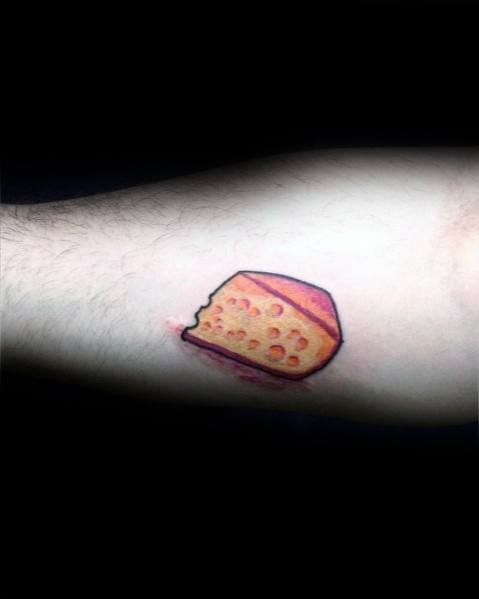 Minimalist tattoo of a small wedge of cheese with a red wax rind, featuring simple bold outlines and soft yellow-orange shading for a classic look.