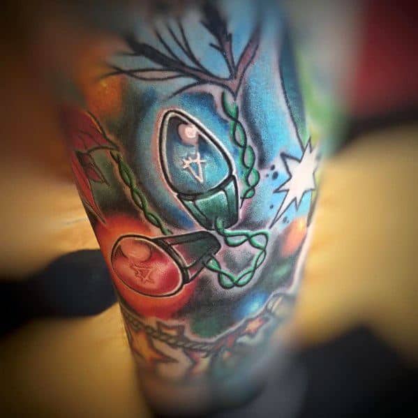 Christmas tattoo featuring oversized glowing holiday light bulbs intertwined with vines, set against a colorful background for a festive and artistic design.
