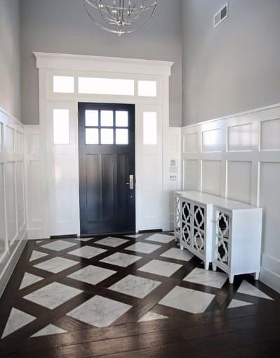patterned marble entryway tiles with wooden border