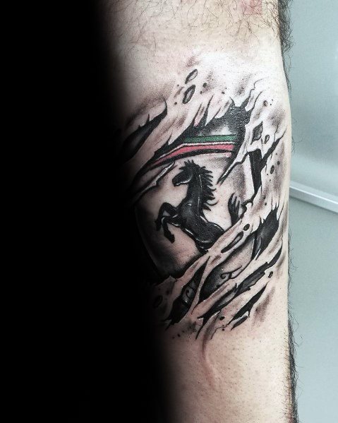 Ferrari shield tattoo with dramatic ripped-skin effect, revealing prancing horse and Italian colors beneath, inked on man's arm.