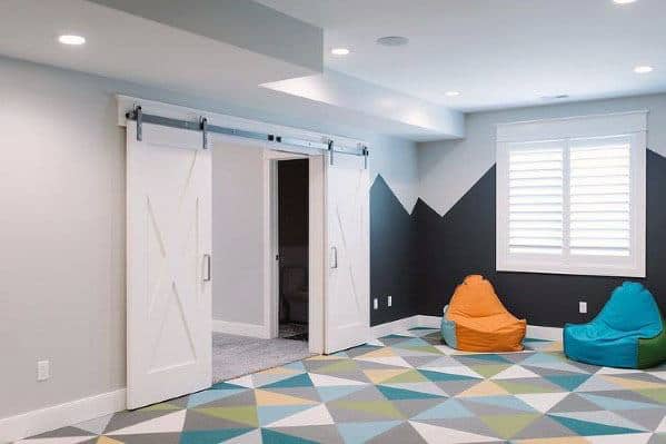kids basement playroom with mural art