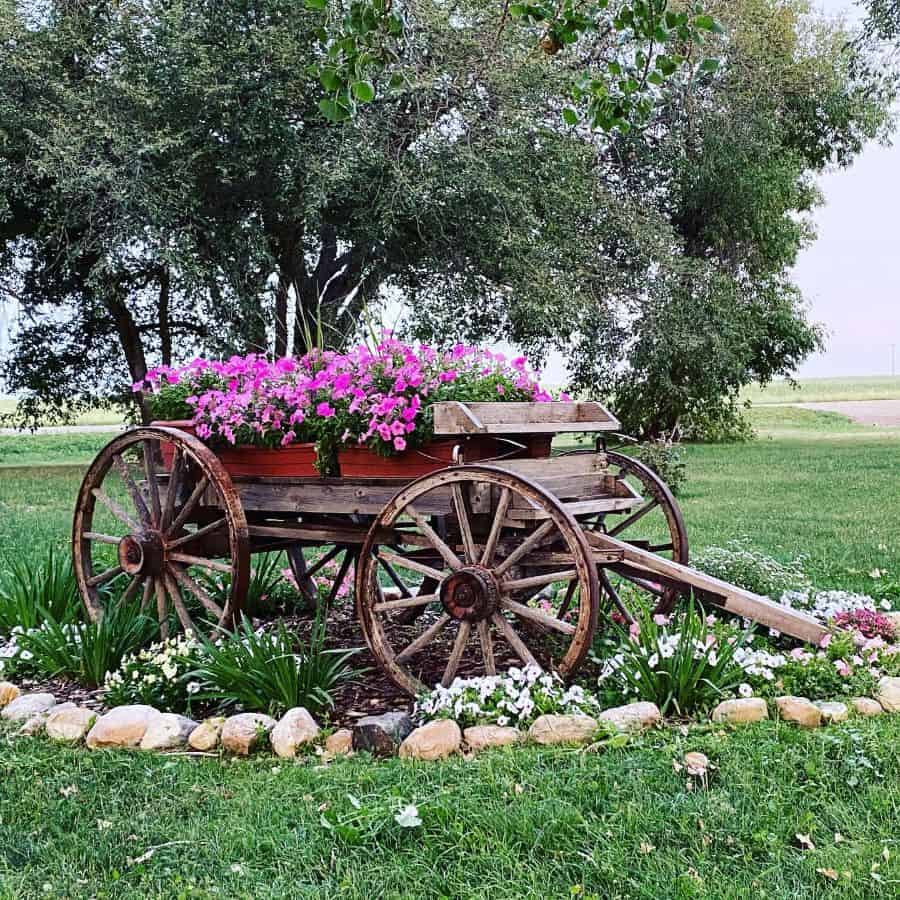 unique wood cart flower bed pink flowers