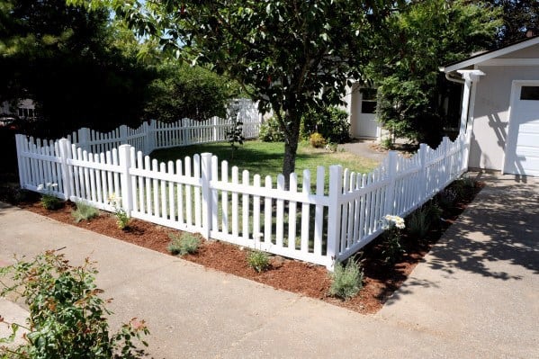 classic white picket fence concrete driveway 