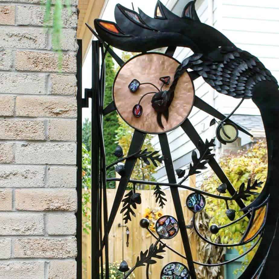 unique black metal garden gate with gemstones