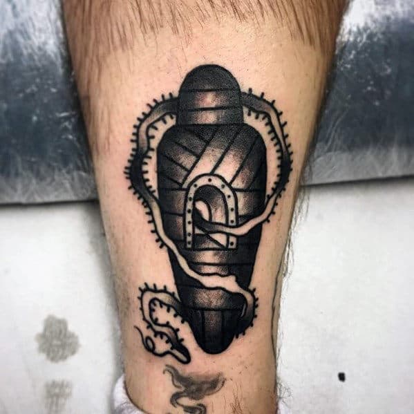 Unique Guys Traditional Mummy Tattoo On Back Of Lower Leg