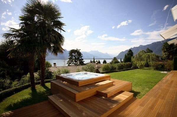 tiered wood deck hot tub river view