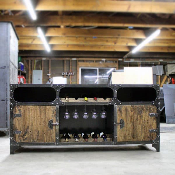 Industrial-style wine cabinet with wooden doors, glass holders, and bottle storage set against a warehouse background