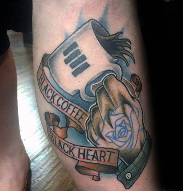 Colorful tattoo of a hand holding a mug with Black Flag bars, surrounded by a banner reading “Black Coffee Black Heart” and a blue rose detail.