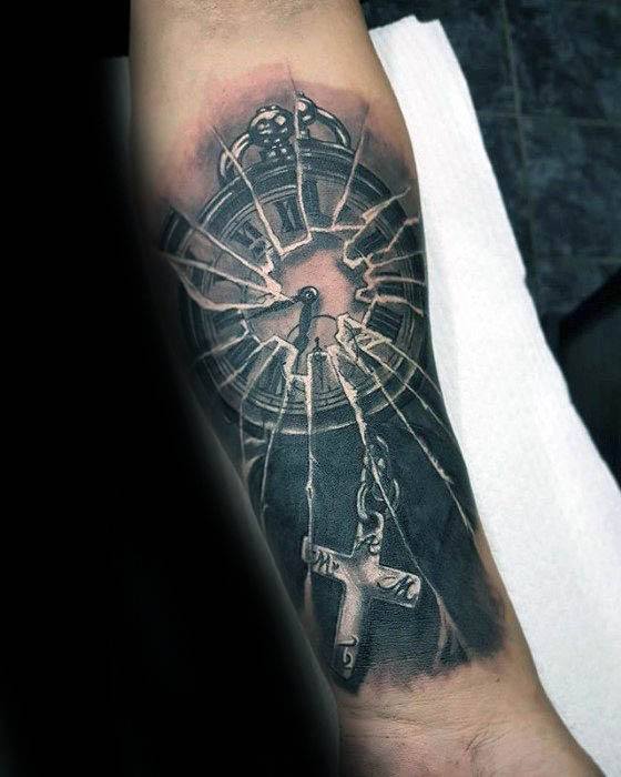 Realistic tattoo of a shattered clock with a rosary and cross breaking through the glass, symbolizing faith, time, and inner conflict.