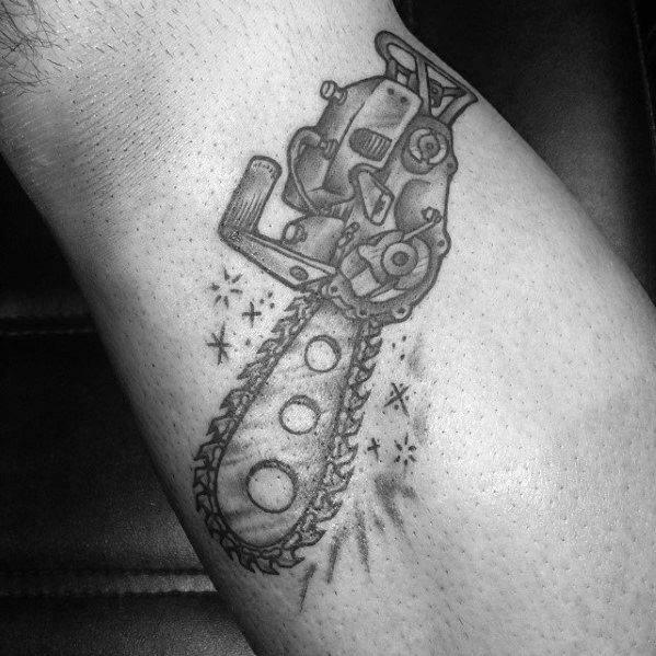 Black and gray chainsaw tattoo with sparkles and a stylized blade featuring three circular cutouts, blending mechanical and whimsical tones.