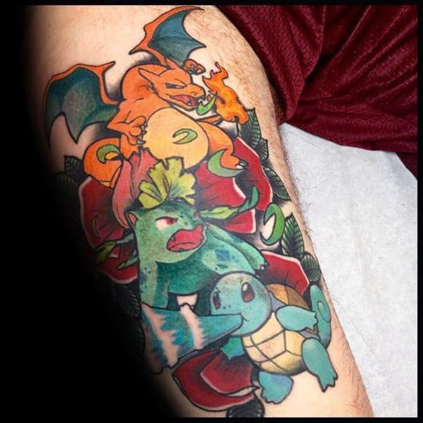 Colorful tattoo of Charizard, Venusaur, and Squirtle in battle-ready poses with bold outlines and a vibrant floral background.