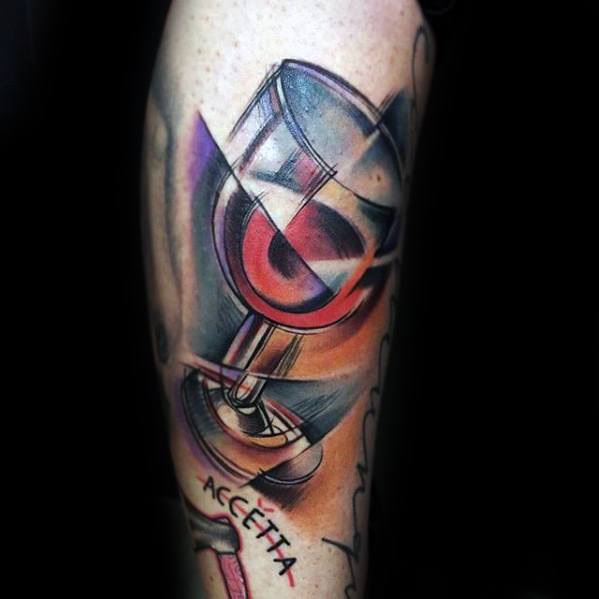 Cubist-style tattoo of a wine glass with red wine, designed with sharp geometric lines, soft color gradients, and abstract purple-pink accents.