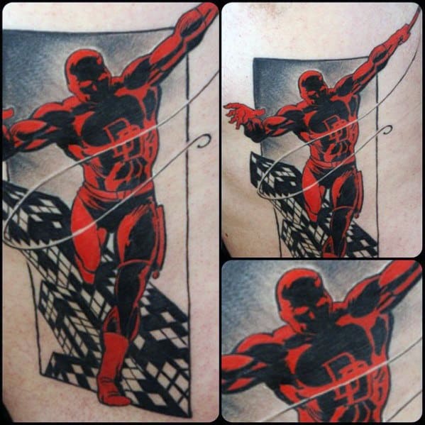 Stylized Daredevil tattoo with bold red and black contrast, dynamic rooftop pose, and abstract cityscape in the background.