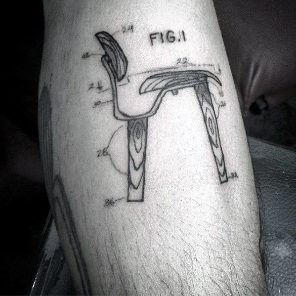Tattoo of a patent-style drawing labeled “FIG.11,” depicting a mid-century modern chair with numbered parts and wood grain detailing.