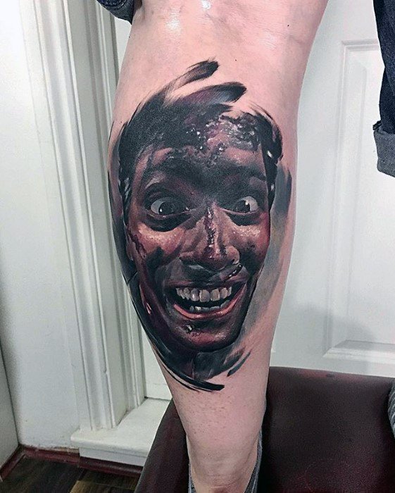 Hyper-realistic Evil Dead tattoo of Ash with a crazed grin and wide eyes, surrounded by painterly black smudges for a chaotic horror effect
