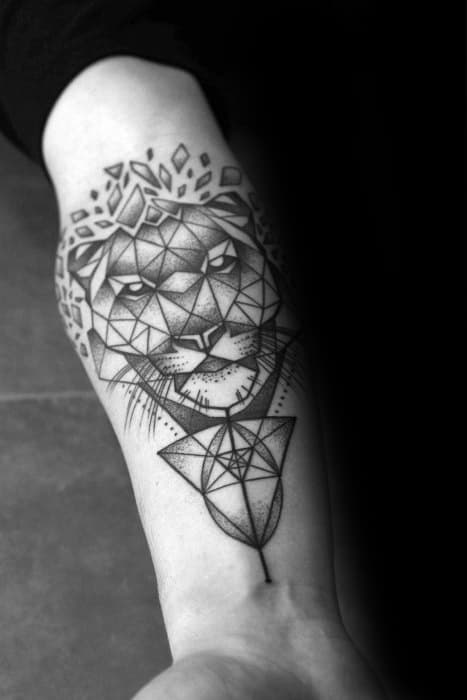 Geometric tiger tattoo on forearm with dotwork shading, symmetrical patterns, and crown-like shapes above for a regal, modern style.