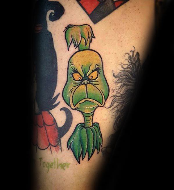 Grinch character with an angry expression, outlined in bold black lines with vibrant green and yellow details, creating a playful and expressive tattoo design.