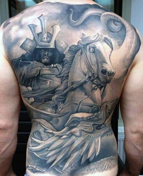 Full back black and grey tattoo of a samurai warrior on horseback with intense shading, dynamic movement, and detailed armor design
