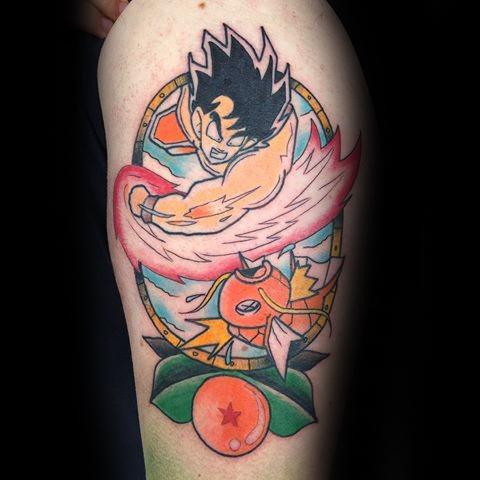 Crossover tattoo featuring Goku from Dragon Ball mid-attack with Magikarp and a Dragon Ball, blending anime styles with vibrant colors.