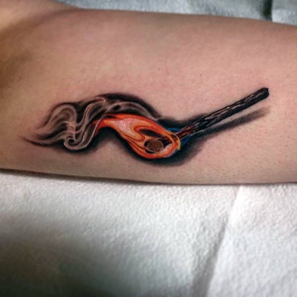 Realistic tattoo of a burning matchstick with detailed flame and smoke, symbolizing passion, transformation, or the power of a single spark.