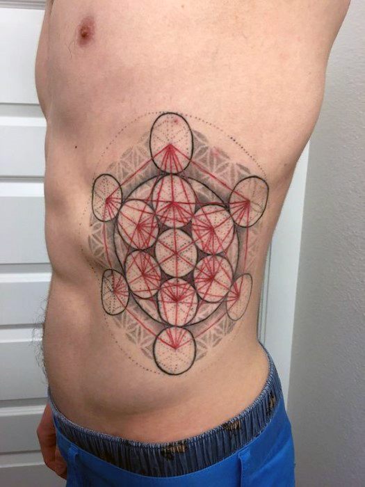 Side torso tattoo of Metatron’s Cube in red and black ink, layered over soft grey geometric shading for a vibrant and dimensional design.