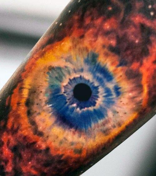 Realistic nebula tattoo design resembling a vibrant cosmic eye with intricate color details