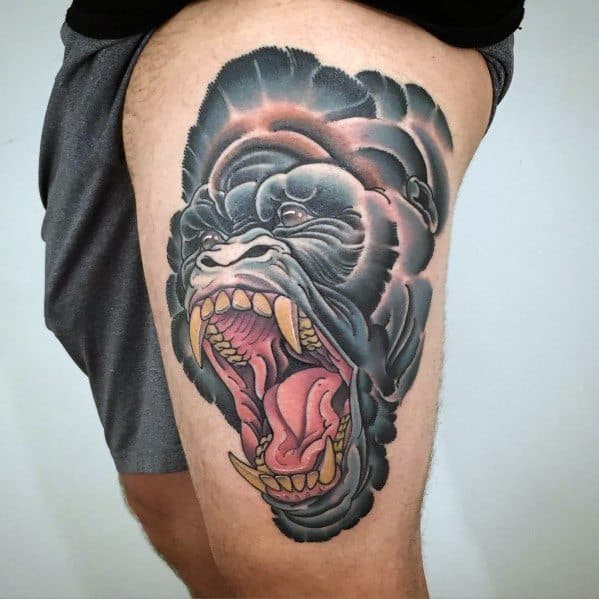 Neo-traditional roaring gorilla tattoo on thigh with sharp teeth, dramatic shading, and a bold black and pink color palette.