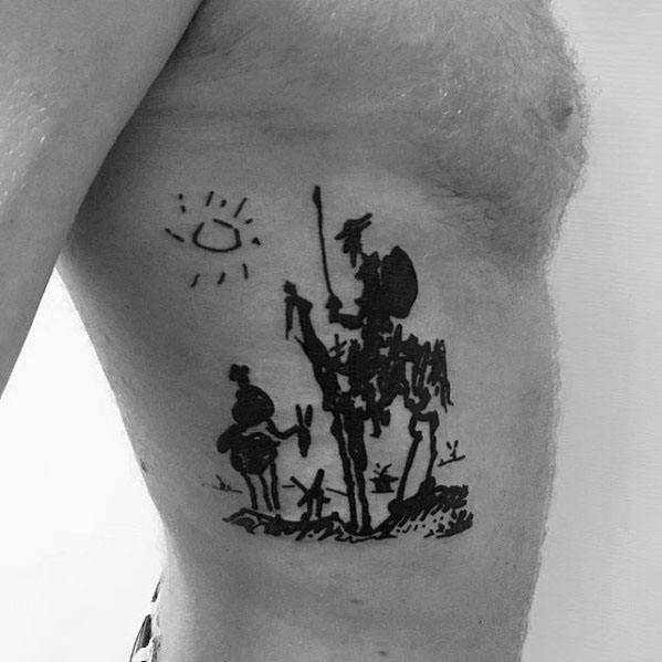 Ribcage tattoo of Picasso’s sketch-style *Don Quixote*, featuring the iconic knight, Sancho Panza, windmills, and a minimalist sun.