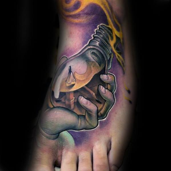 A hand holding a tattooed light bulb with vivid colors and a flame effect, intricately detailed as if etched by a masterful pencil art