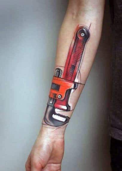 Tattoo of a large red pipe wrench on the forearm in a modern, sketch-style design with bold outlines and artistic shading.