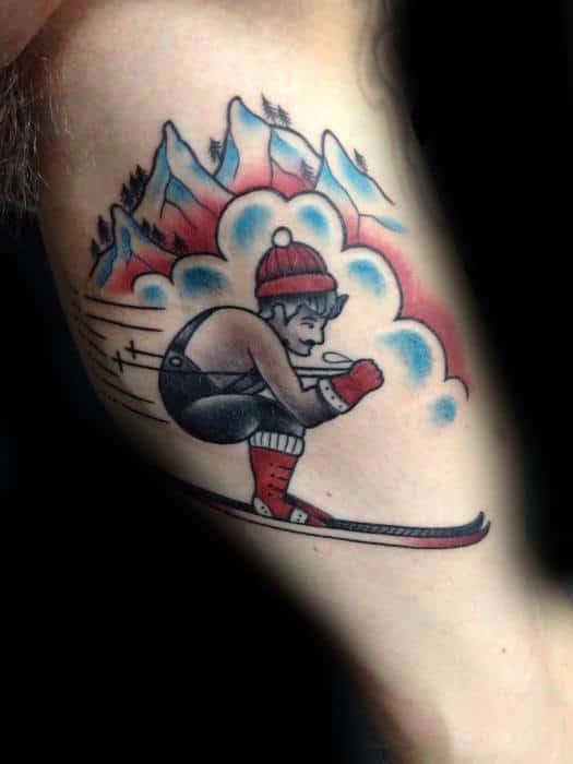 Traditional tattoo of a skier in motion with red winter gear, racing past snowy mountains and pine trees with stylized speed lines and clouds.