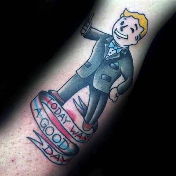 Vault Boy tattoo in a tuxedo giving a thumbs-up, standing above a banner that reads “Today was a good day” in elegant script.