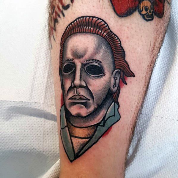 This neo-traditional Michael Myers tattoo features bold lines, shading, and a muted color palette, giving a fresh take on the horror icon.