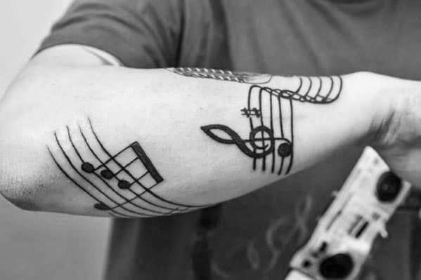 Unique Outer Forearm Black Ink Mens Music Staff Tattoos