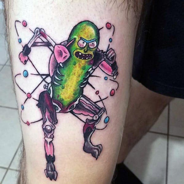 Pickle Rick cyborg tattoo with a fierce pose, biomechanical limbs, and an atomic background, creating a bold and dynamic design on the leg.