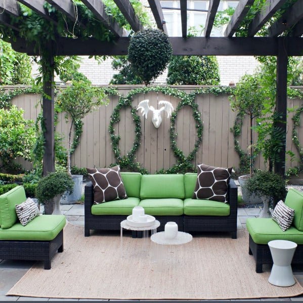 wood privacy fence with green wreathes