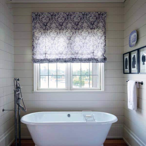 classic white shiplap walls in bathroom with tub
