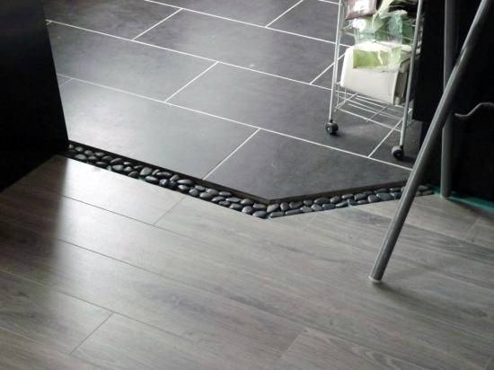 Unique Smooth Pebbles Tile To Wood Floor Transition