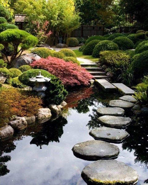 Unique Stepping Stone Over Backyard Pond